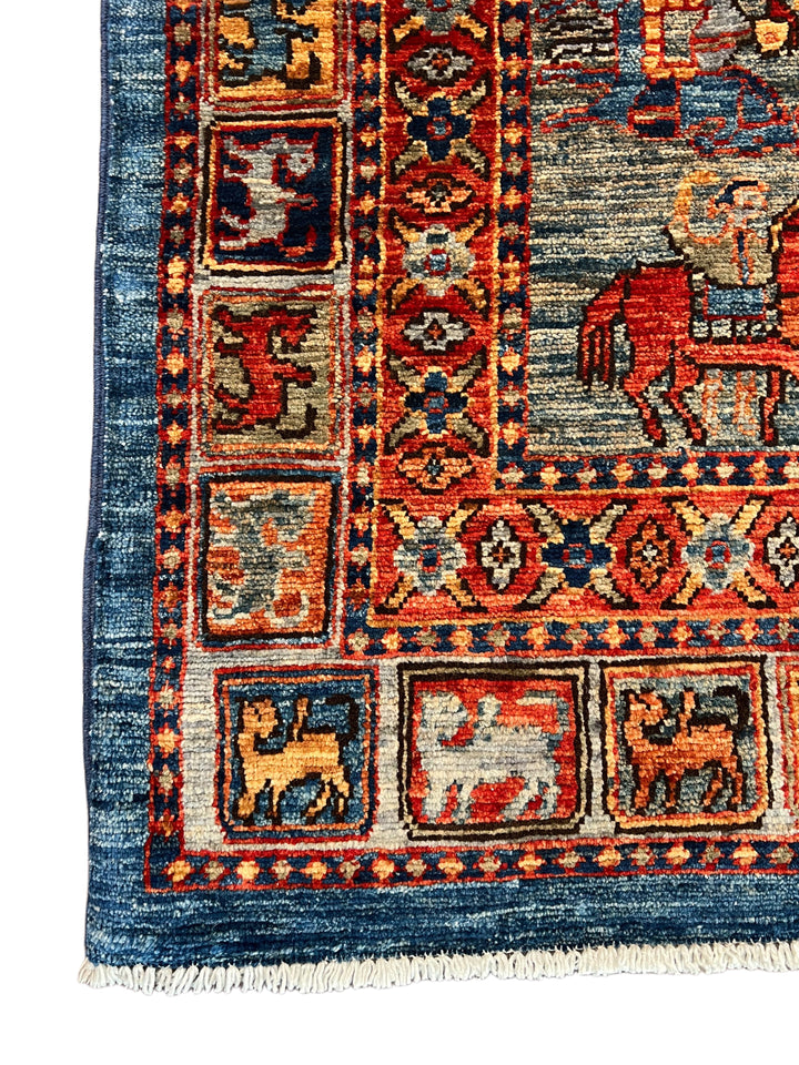 Blue &amp; Rust Pictorial Grid Rug with Horse Motifs – 9’0” × 11’9”