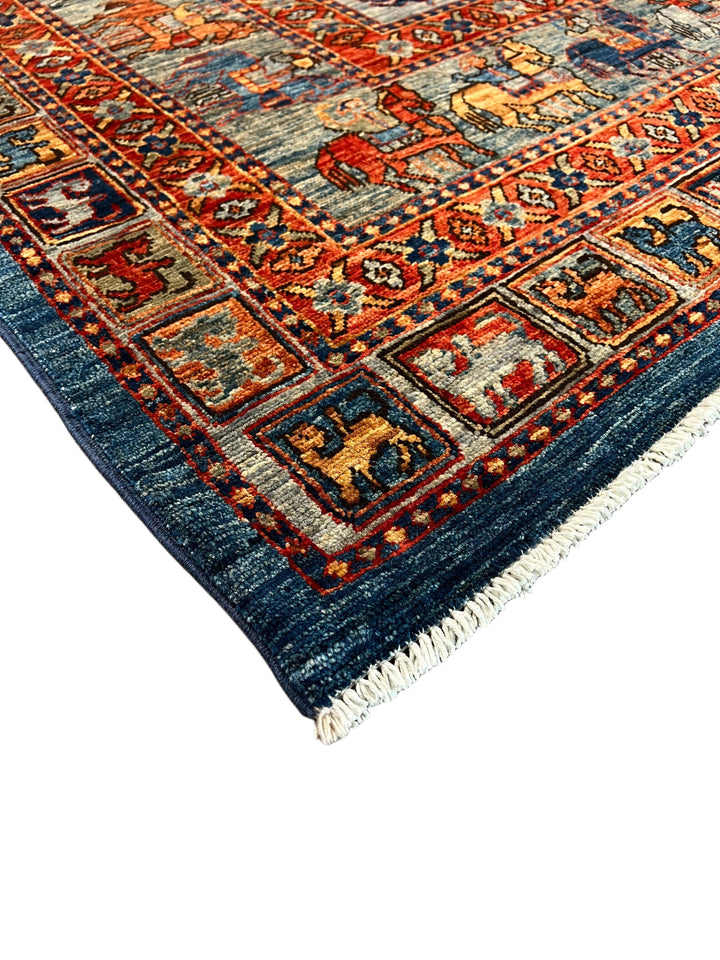 Blue &amp; Rust Pictorial Grid Rug with Horse Motifs – 9’0” × 11’9”